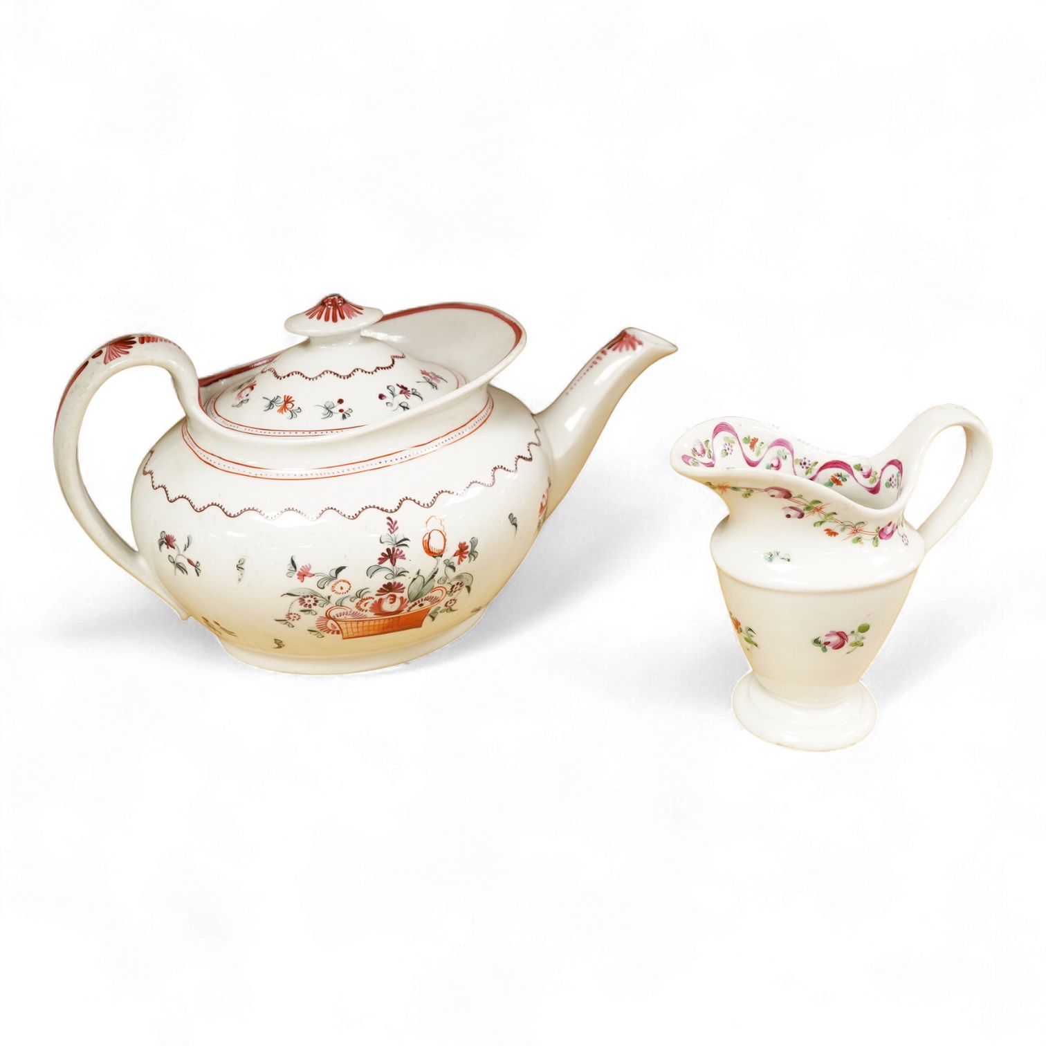 A Newhall porcelain boat shaped teapot, c.1800, together with a cream jug, tallest 14cm